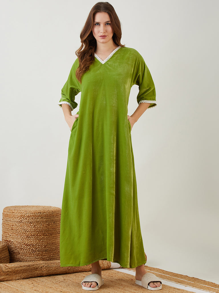  Green Velvet Nightdress featuring a lace-adorned 'V' neck and sleeve hem, and a back elastic for a perfect fit.