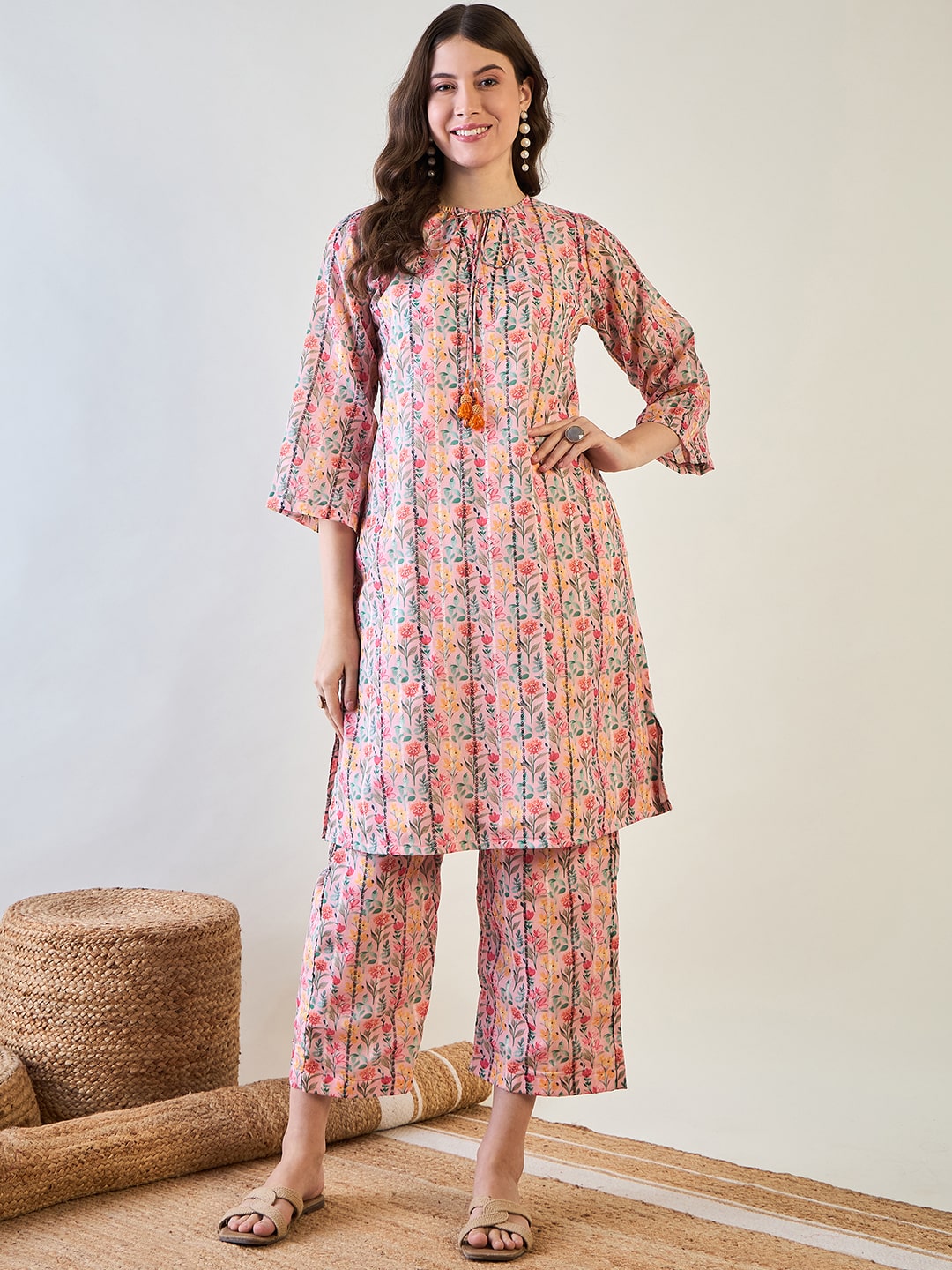 Elegant pink floral striped lurex co-ord set featuring a slim-fit kurta and straight-cut pants.