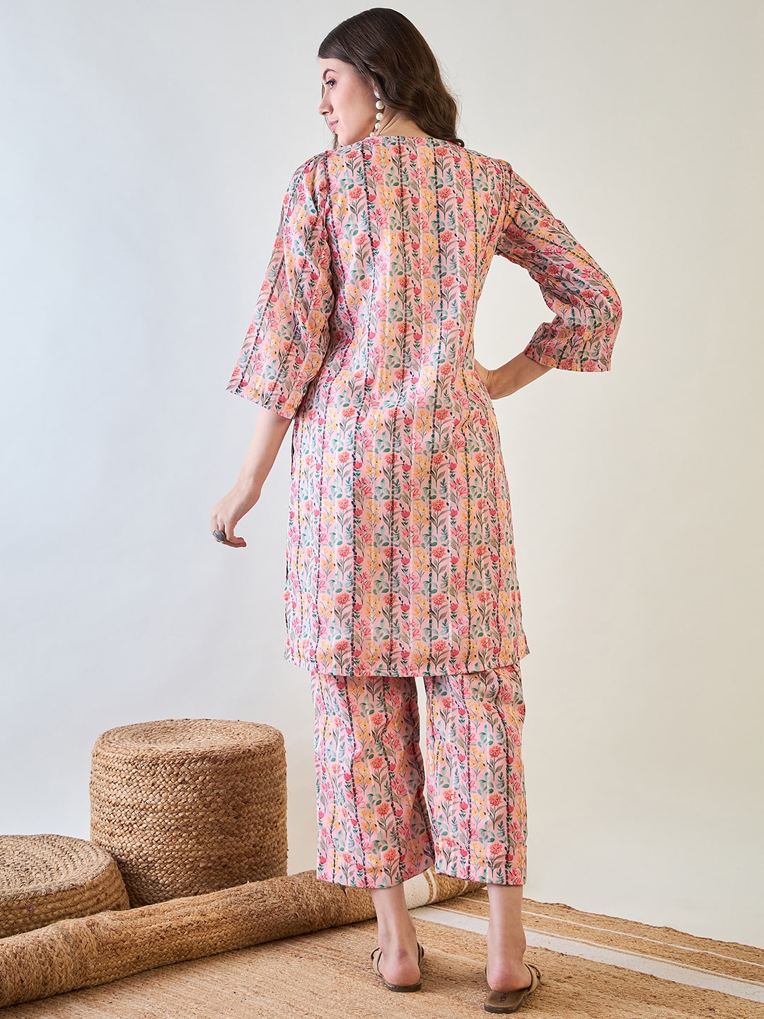 pink floral design on the lurex fabric of the co-ord set.