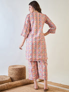 pink floral design on the lurex fabric of the co-ord set.