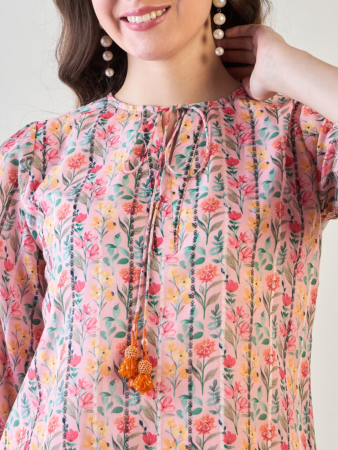 three-quarter sleeve design on the pink floral striped co-ord set.