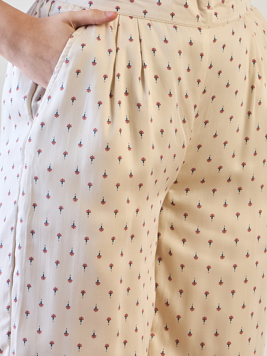 Floral pattern detail on the waistcoat top of the cotton satin coord set.