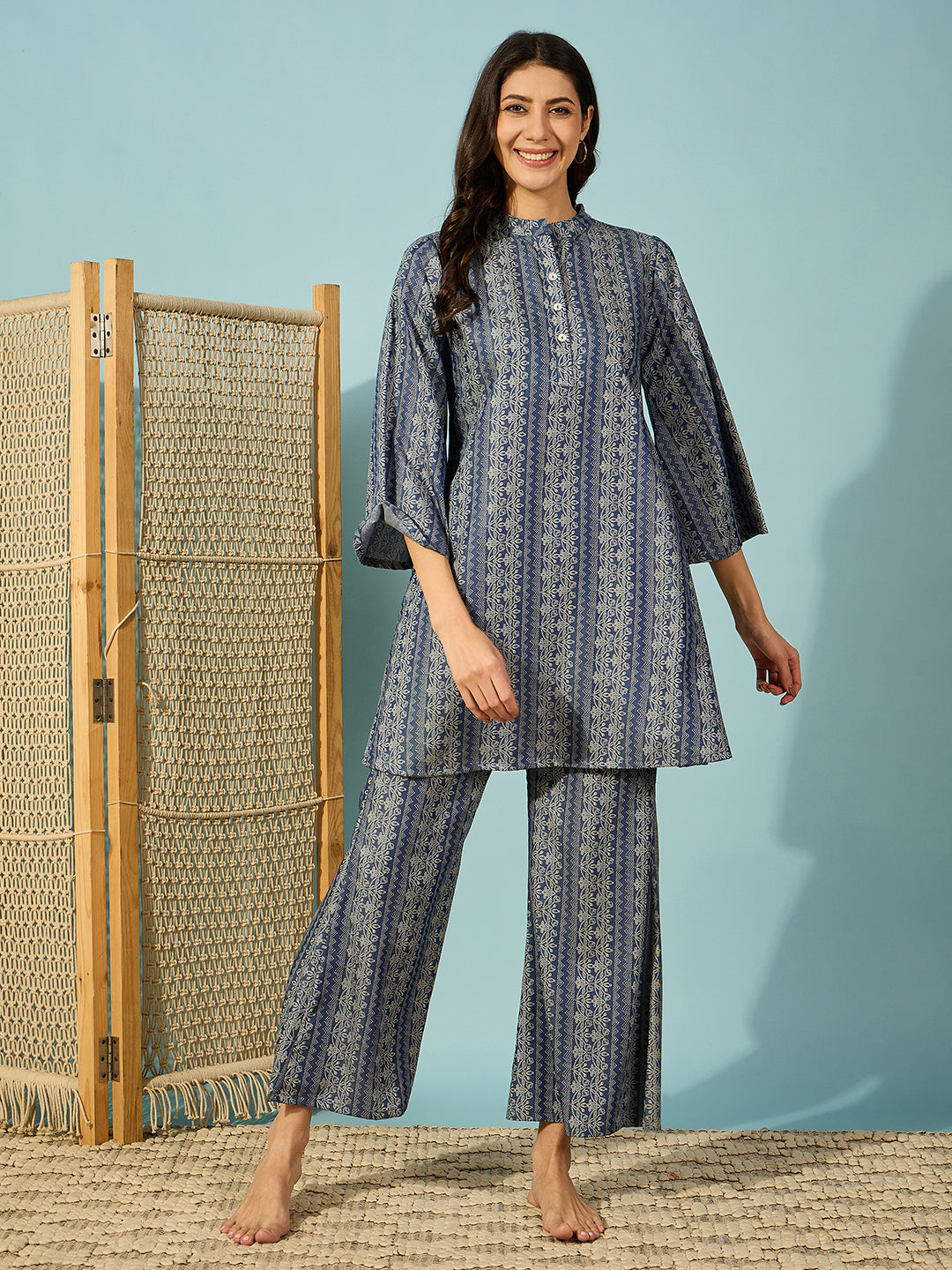 Women light denim co-ord set featuring a button-up top and wide-legged pants for a chic, casual look.
