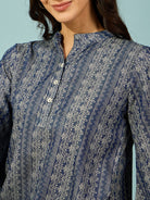 Trendy light denim co-ord set with a slim fit, featuring a buttoned top and wide-legged pants.

