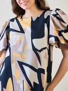 Stylish model showcasing the square neck top and straight-cut pants of the set.