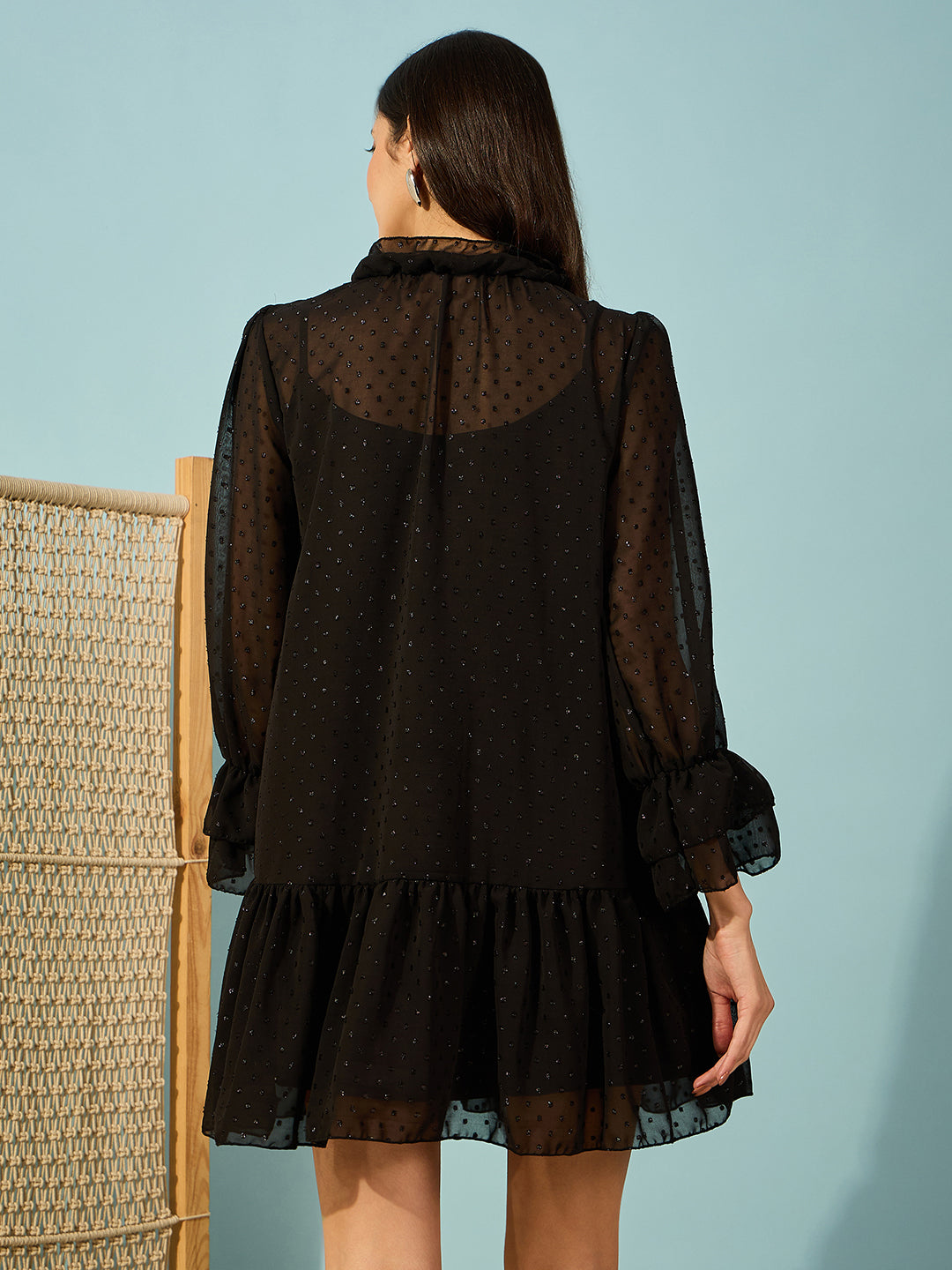 Elevate your evening look with this black ruffle dress in dobby georgette fabric.
