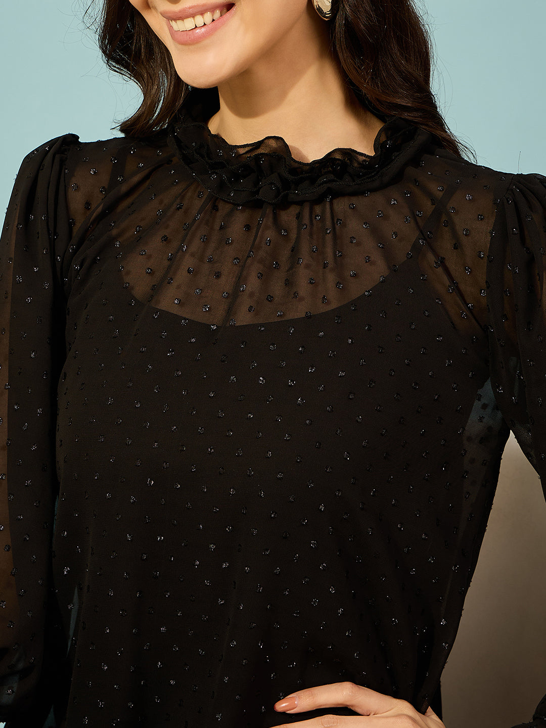 Classic black ruffle dress in dobby georgette, offering comfort and style.
