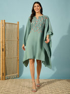 Stand out at any party in this stylish green kaftan dress with embroidered bead details and flowers.
