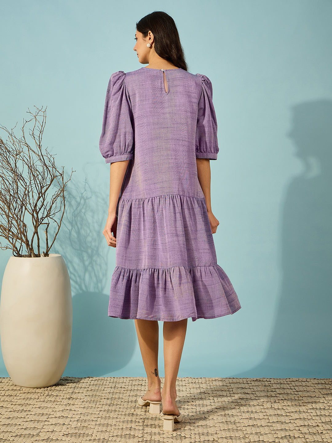 Relaxed-fit purple linen western short length dress with puffed sleeves and elegant hand embroidery.
