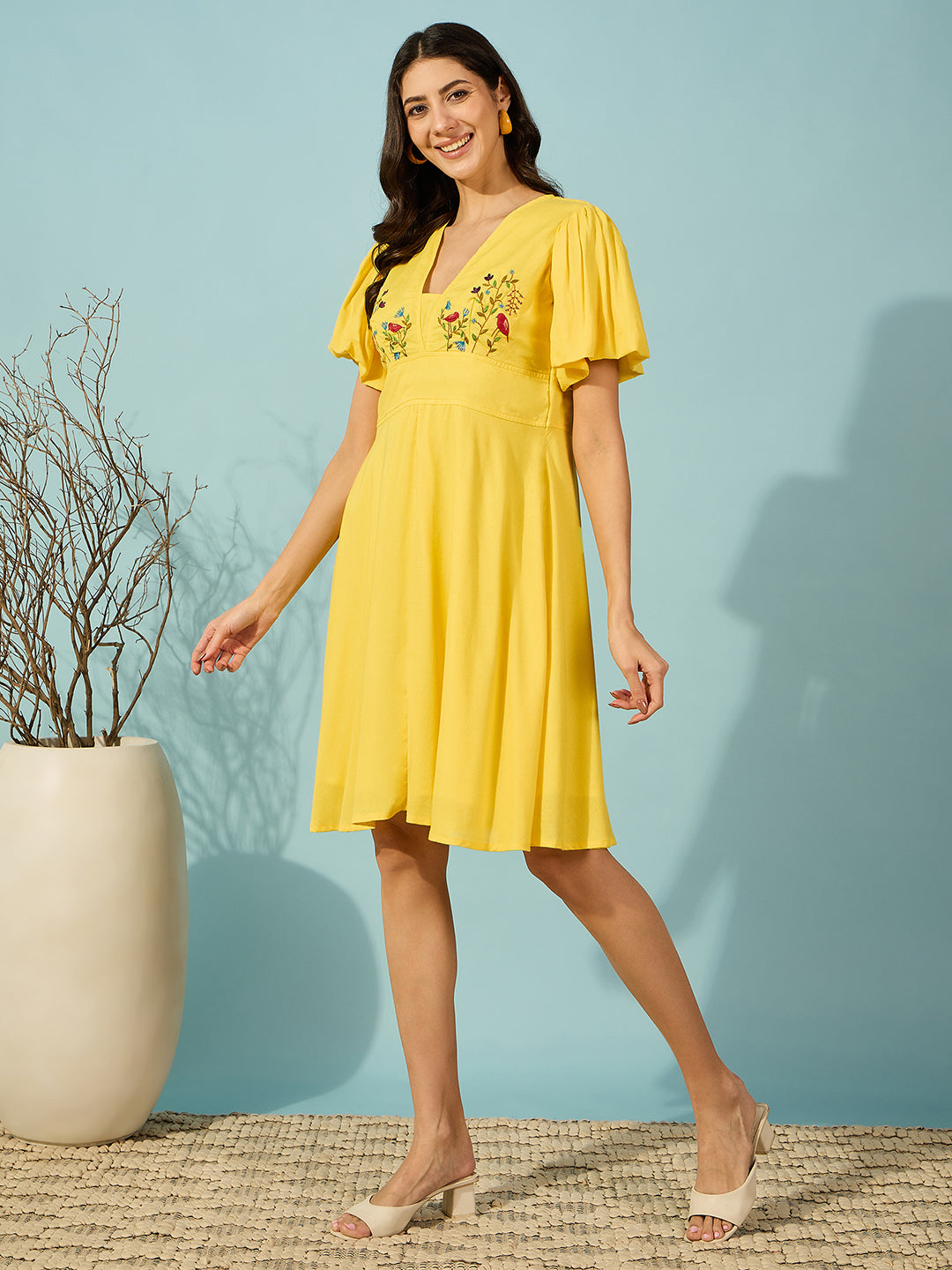 Chic and breathable knee-length viscose linen dress for women in a vibrant yellow hue.
