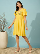 Chic and breathable knee-length viscose linen dress for women in a vibrant yellow hue.
