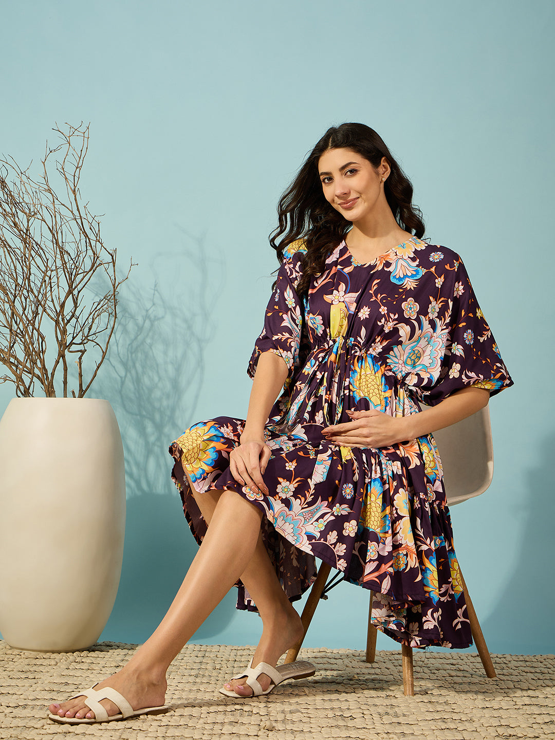 Elegant burgundy floral maternity dress with an adjustable waist tie, offering a perfect fit for every stage.
