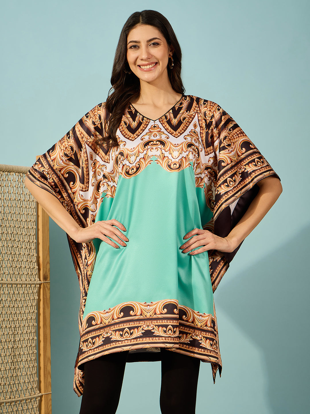 Elegant light green satin kaftan dress with intricate baroque print, perfect for a sophisticated look.
