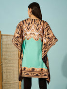 Luxurious satin light green kaftan dress with baroque print and a flattering V-neck, ideal for festive gatherings.
