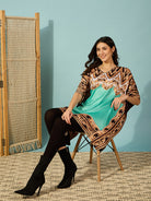 Graceful light green satin kaftan dress with an elegant baroque print, offering a timeless and refined silhouette.
