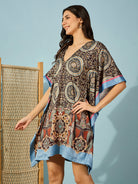 Chic black satin kaftan dress with decorative baroque print â‚¬€œ perfect for cocktail parties and weddings.
