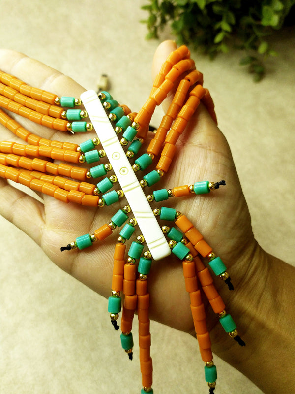 Stylish layered necklace crafted from Naga beads in striking orange and blue hues, showcasing a unique design that captures attention.
