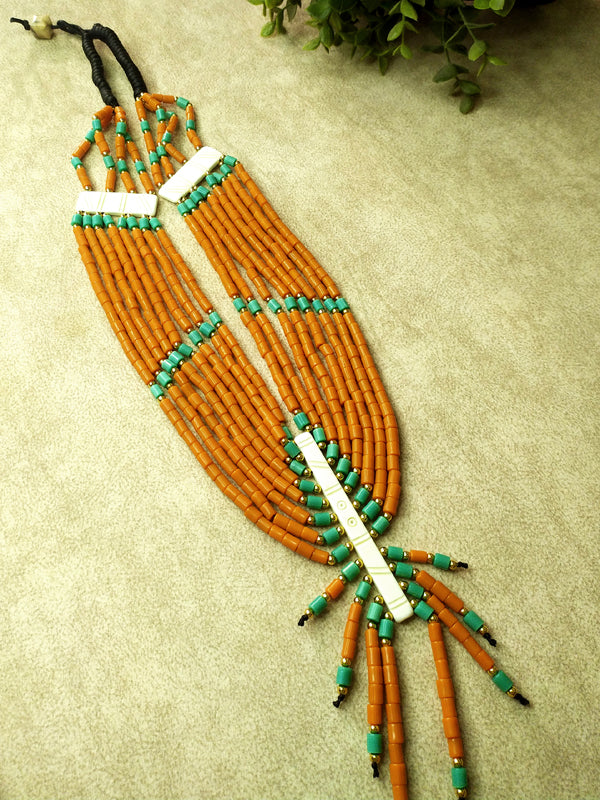 Eye-catching orange and blue Naga bead layered necklace designed for versatility, suitable for both casual wear and special occasions.
