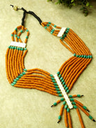Handmade orange and blue Naga bead layered necklace that combines traditional craftsmanship with contemporary design.
