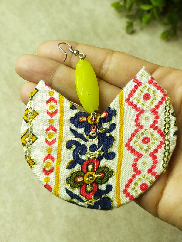 Stylish oversized fabric earrings crafted from lightweight materials, showcasing a vibrant and artistic look.
