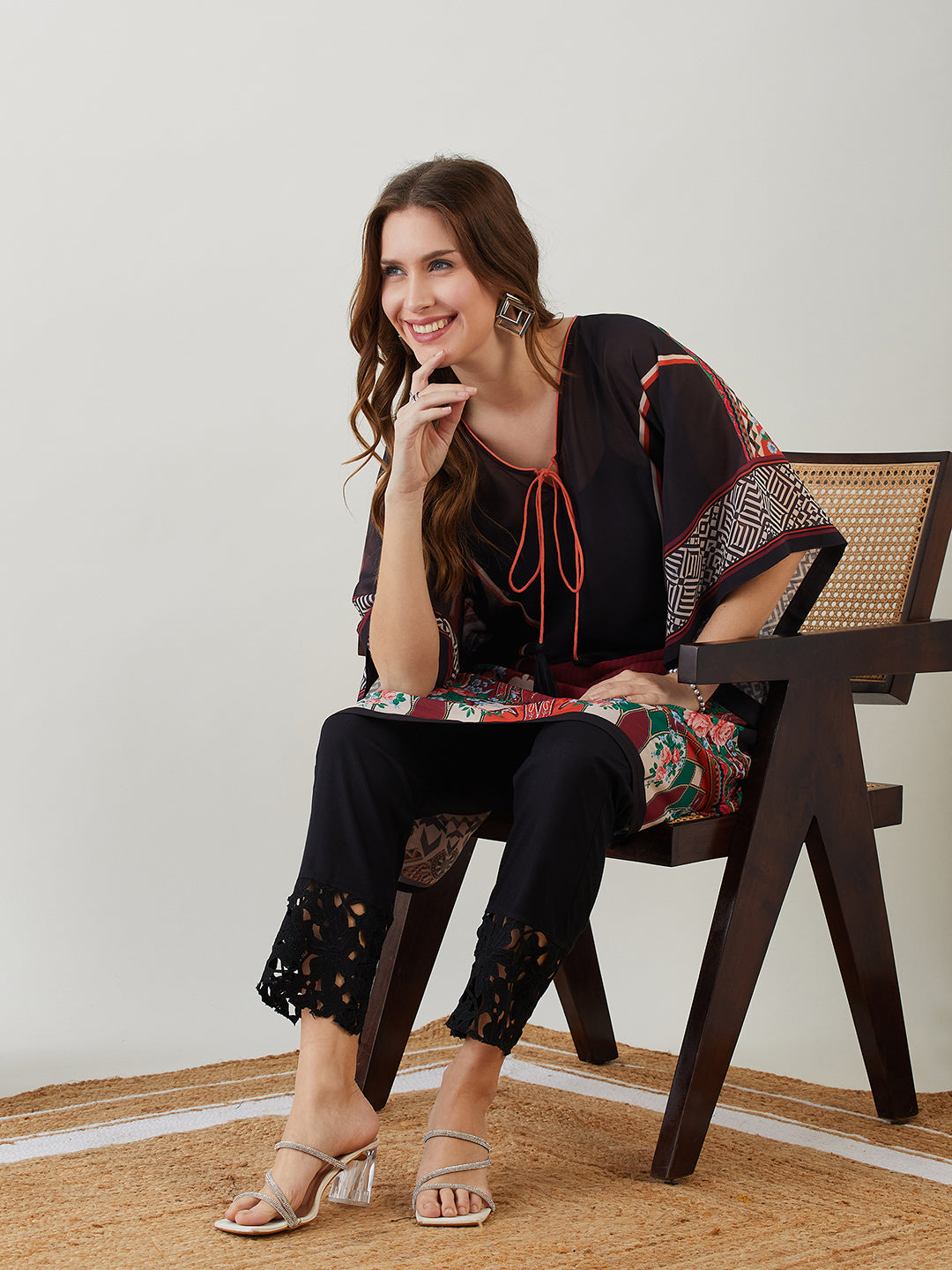 Women black kaftan kurti with a V-neck and three-quarter sleeves, perfect for any occasion