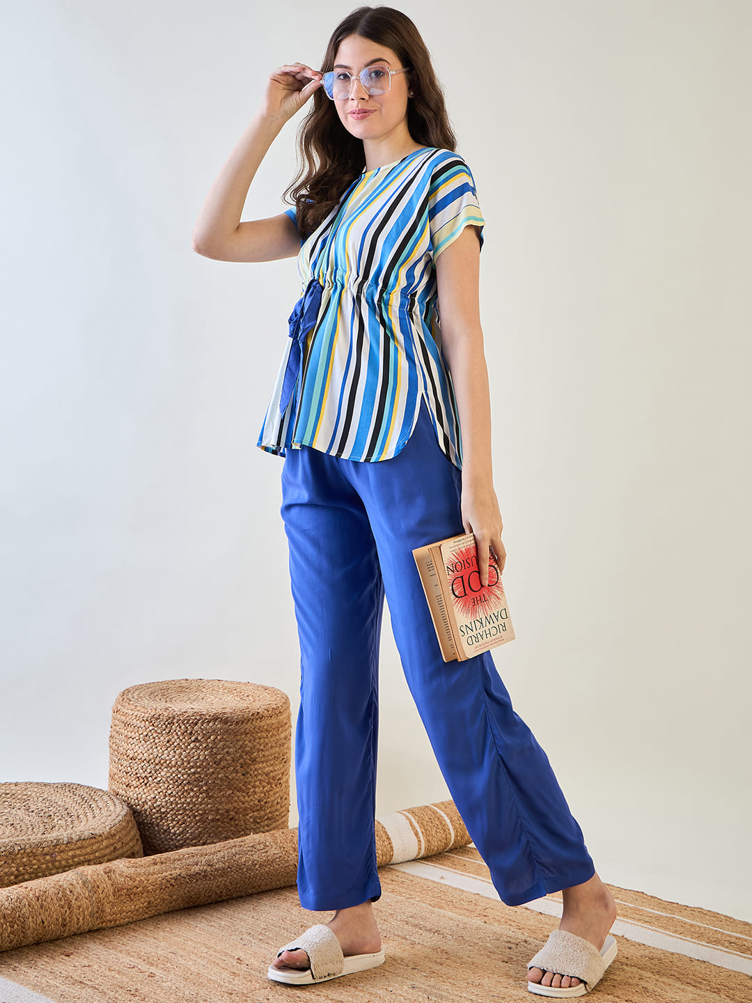 Relaxed fit striped top with V-neck design and blue pajama pants.