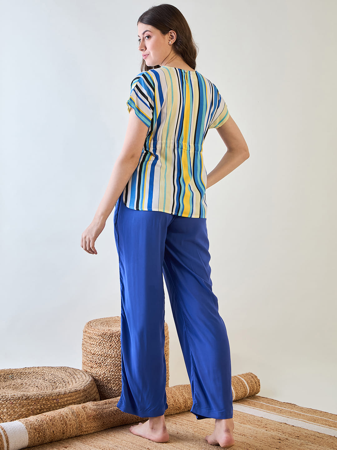 Women's striped top with blue and white stripes, paired with blue pajamas.