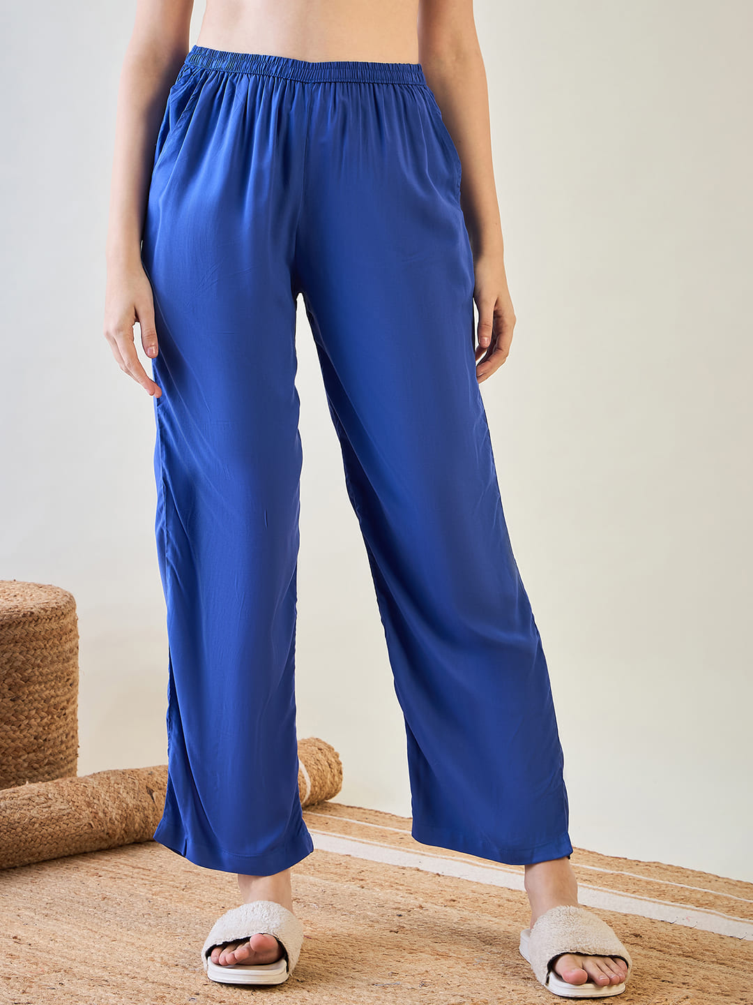 Casual striped top and blue pajama pants for lounging in style.