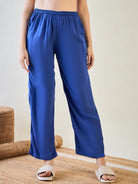 Casual striped top and blue pajama pants for lounging in style.