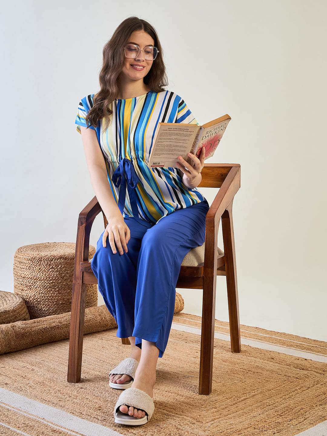 Comfortable co-ord set featuring blue pajamas and a striped top.