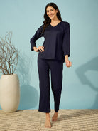 Women cozy navy ribbed pyjama set with a V-neck and full sleeves for a relaxing night in.
