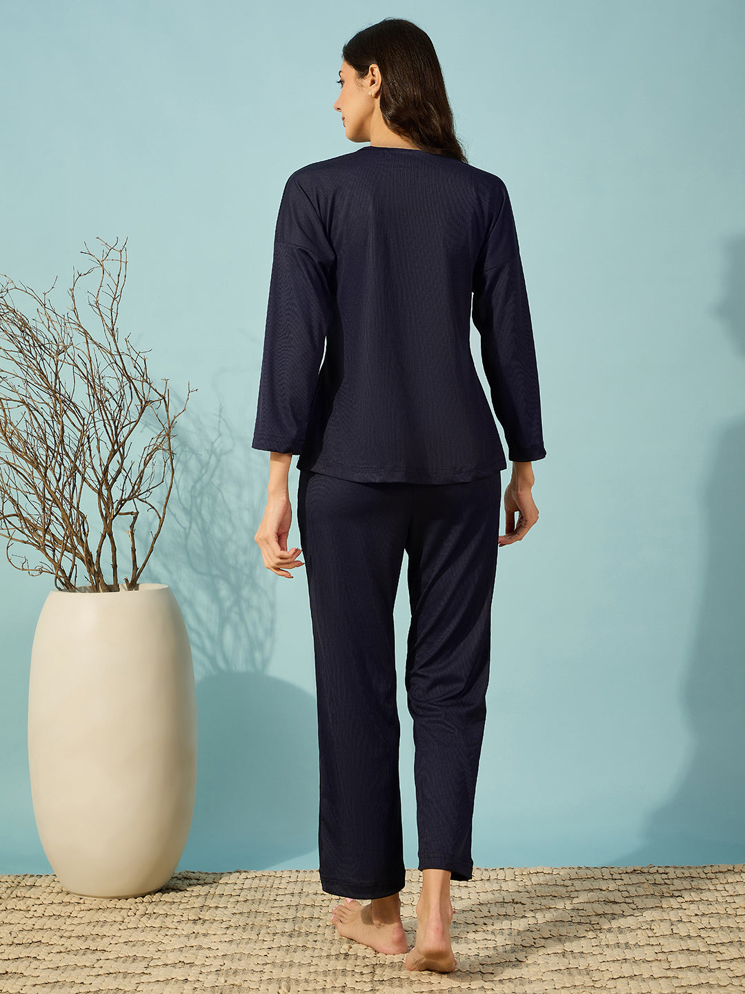 Elegant navy ribbed pyjama set with a V-neck and full sleeves, perfect for cozy evenings.
