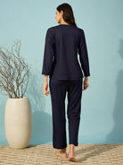 Elegant navy ribbed pyjama set with a V-neck and full sleeves, perfect for cozy evenings.
