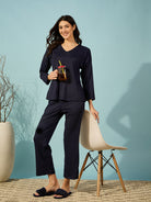 Relax in style with this navy blue ribbed pyjama set featuring a V-neck and full sleeves.
