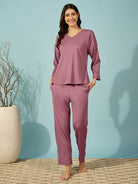 Relaxed purple ribbed pyjama set for women with a V-neck top and full sleeves.
