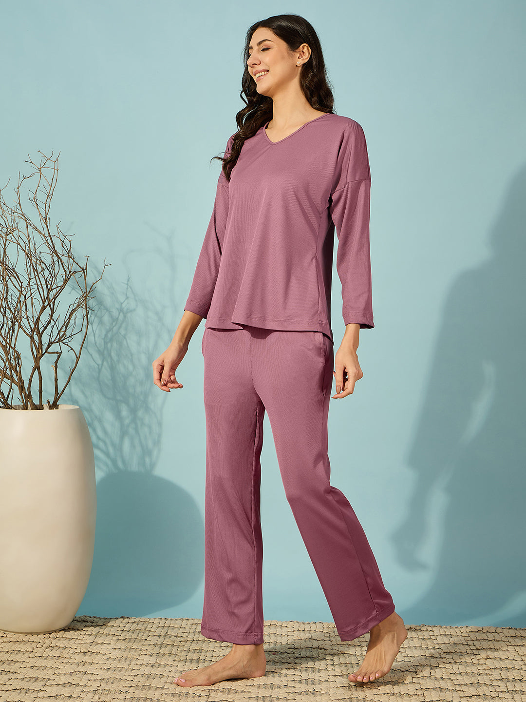 Comfortable and cozy purple pyjama set, perfect for lounging or a restful night.
