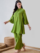 Stay relaxed and chic in the Green Solid Minimalistic Pyjama Set, perfect for casual days.
