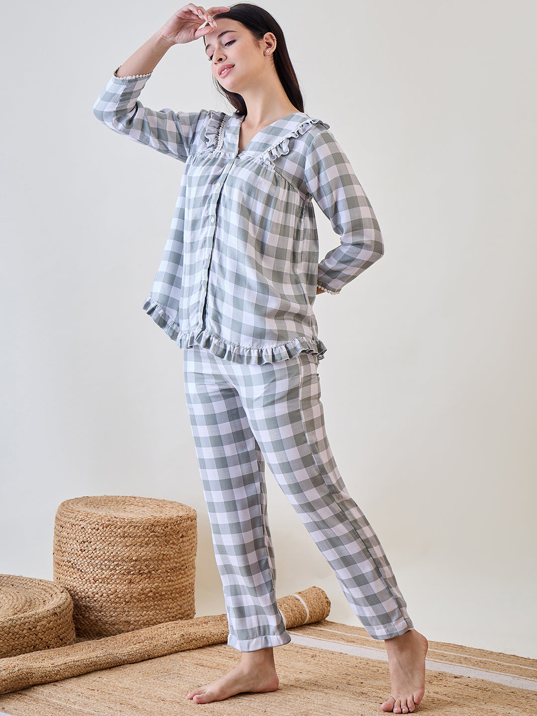 Relax in comfort with the Green and White Checks Ruffled Viscose Pyjama Set with Lace Detail.
