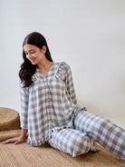 Add elegance to your sleepwear with the Green and White Checks Ruffled Pyjama Set with Lace Detail
