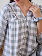 Experience ultimate comfort with the Green and White Checks Ruffled Viscose Pyjama Set with Lace Trim.
