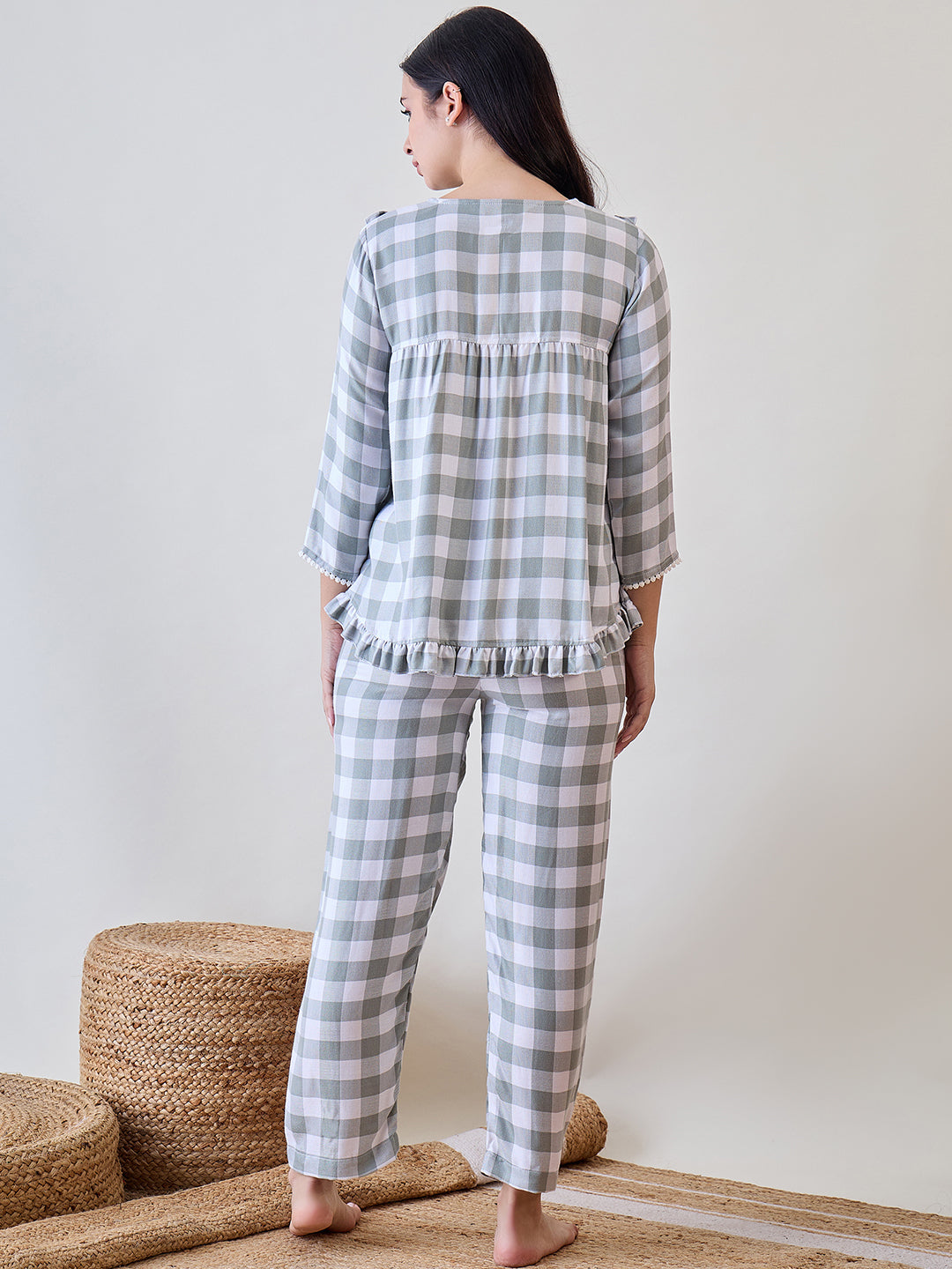 Upgrade your loungewear with the Green and White Checks Ruffled Viscose Pyjama Set with Lace Detail
