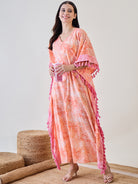 Upgrade your loungewear collection with the Orange Abstract Floral Pink Tasseled Cotton Kaftan Nightdress
