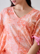 Indulge in the softness and vibrant design of the Orange Abstract Floral Pink Tasseled Cotton Kaftan Nightdress
