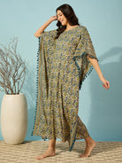 Chic and flowy yellow cotton kaftan for women, featuring vibrant floral prints and a striped border.
