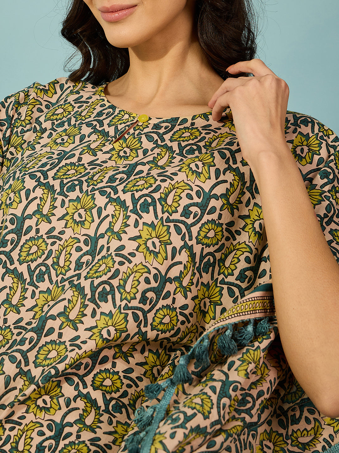 Women's lightweight yellow kaftan in breathable cotton with floral design and striped border accents.
