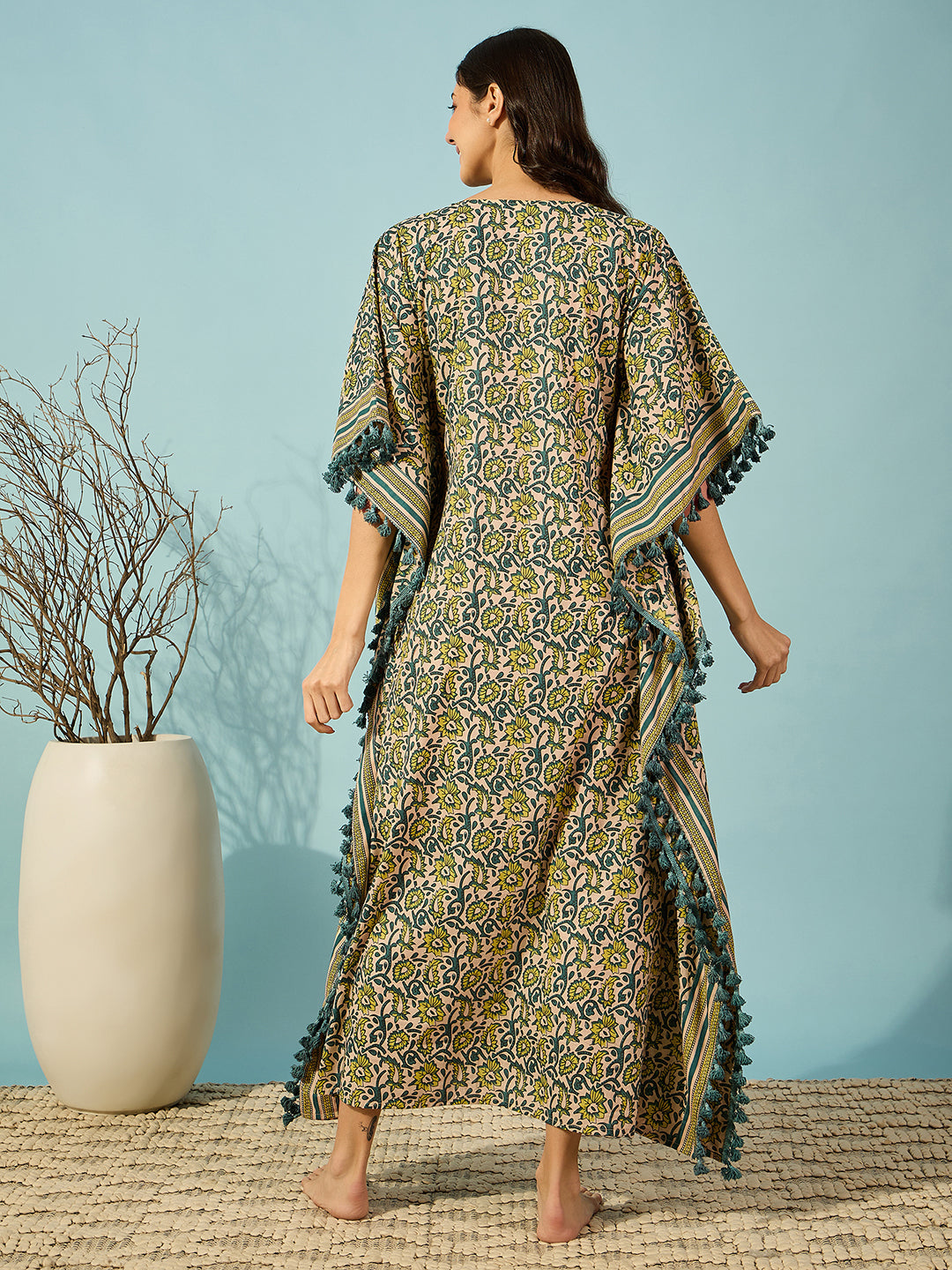 Women's floral kaftan in sunny yellow cotton, complemented by a bold striped border for modern flair.

