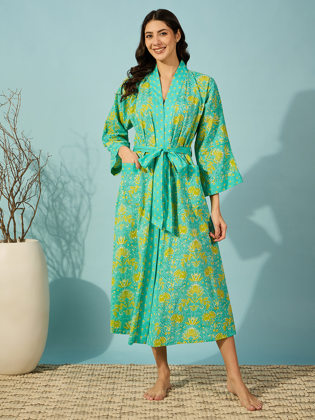 Elegant floral cotton night gown in blue, featuring a matching waist belt.
