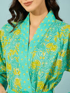 Comfortable and chic floral blue cotton gown with full sleeves and waist belt.

