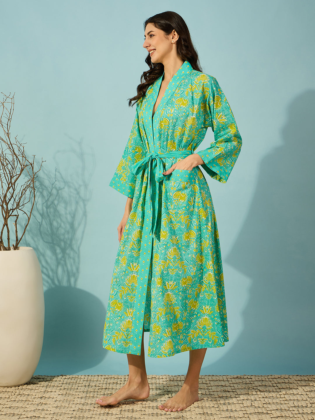 Charming floral blue cotton wrap gown with stylish striped detailing.

