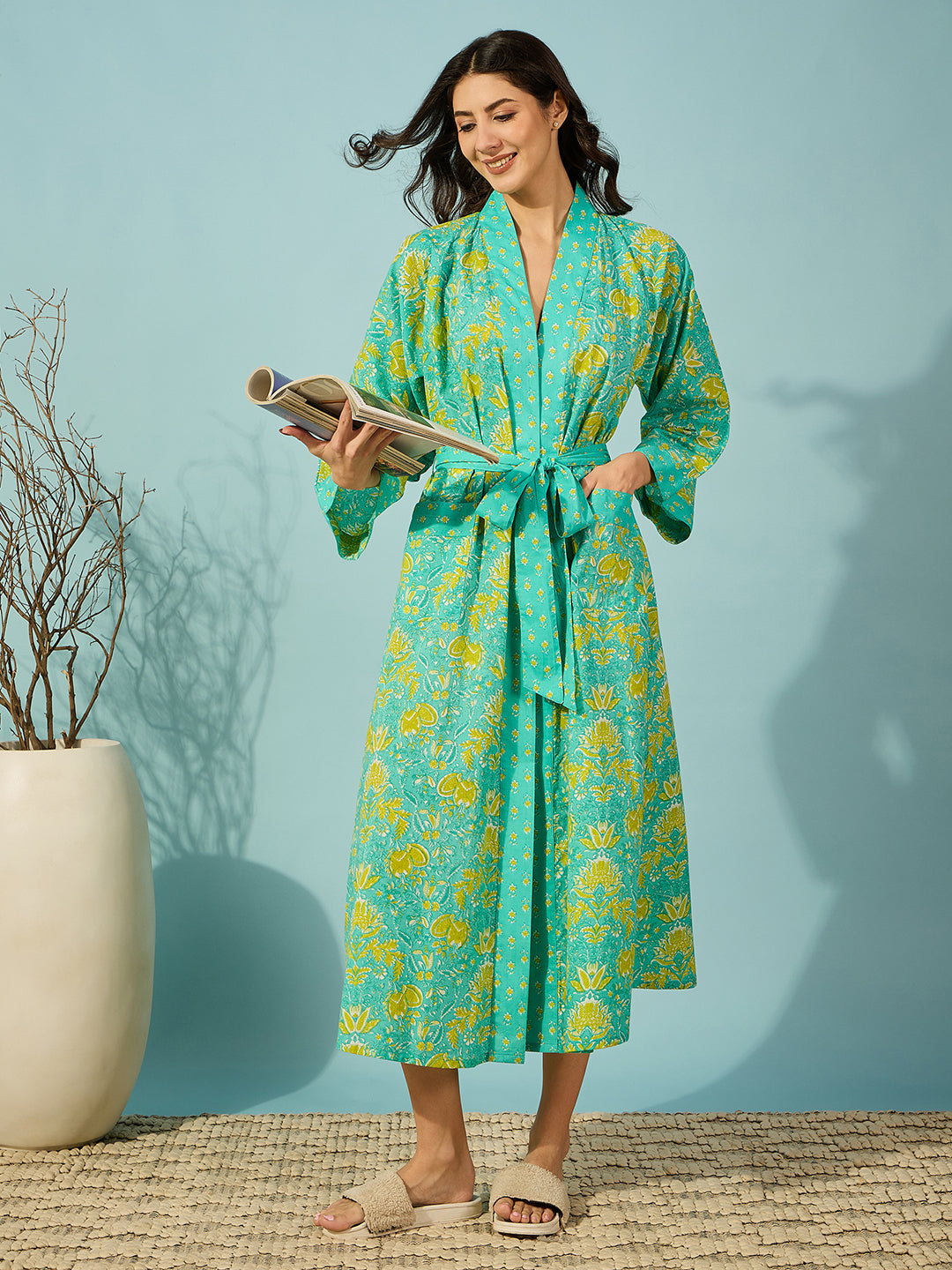 Floral blue cotton wrap night gown with full sleeves and striped edges.
